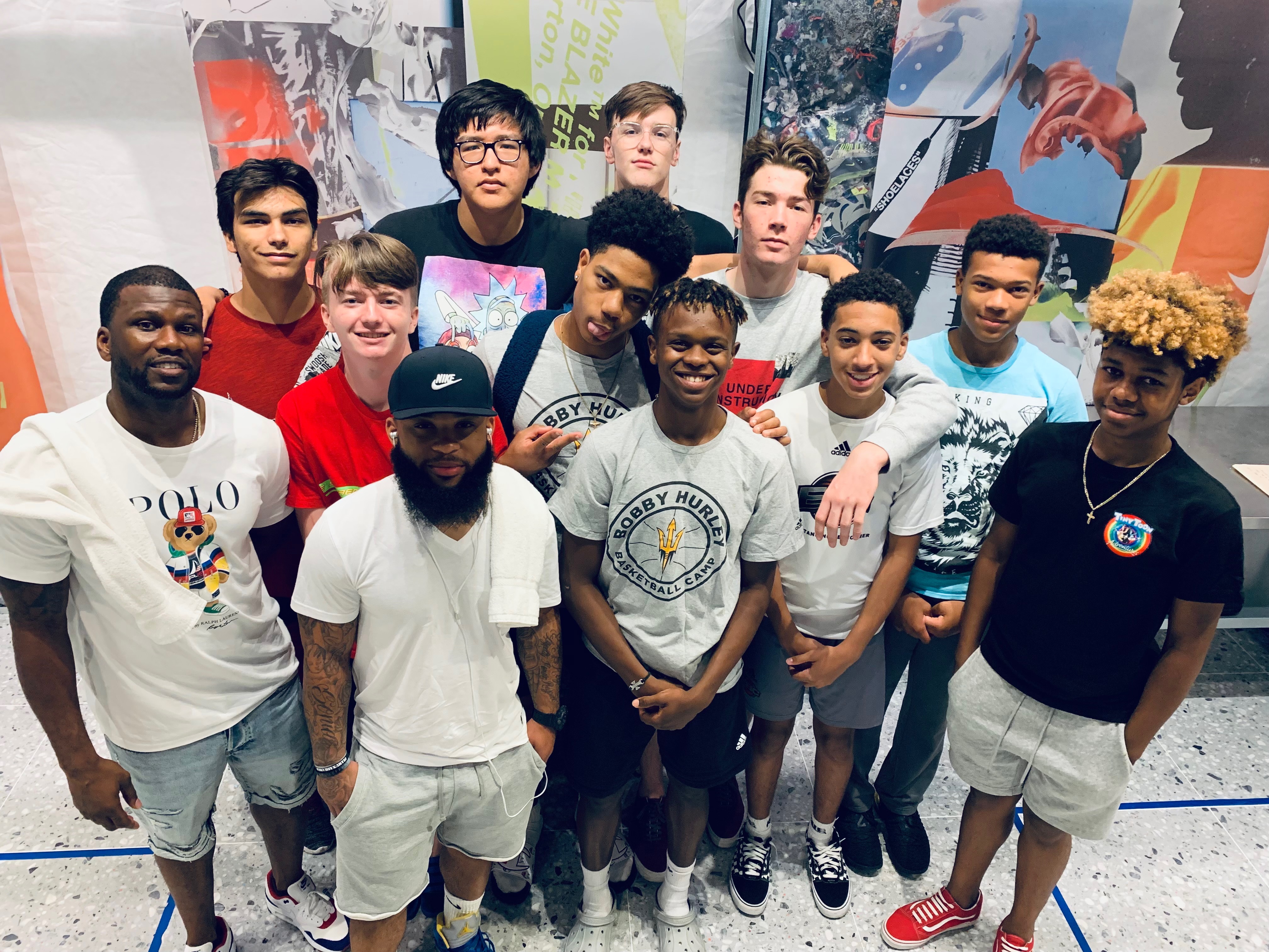 Youth participants and mentors posing together during a community outing